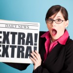SurprisedWomanHoldingNewspaper
